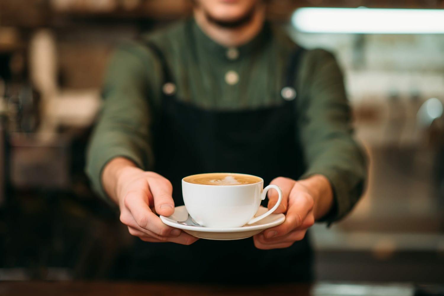 coffee being served by a waiter